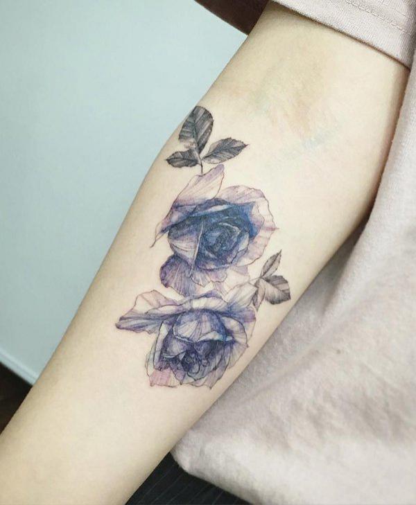 Sketchy blue roses on arm