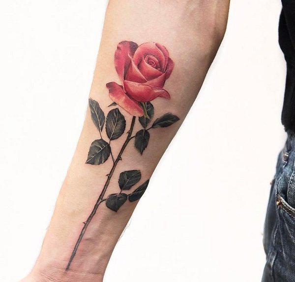 Single stem rose with horns tattoo