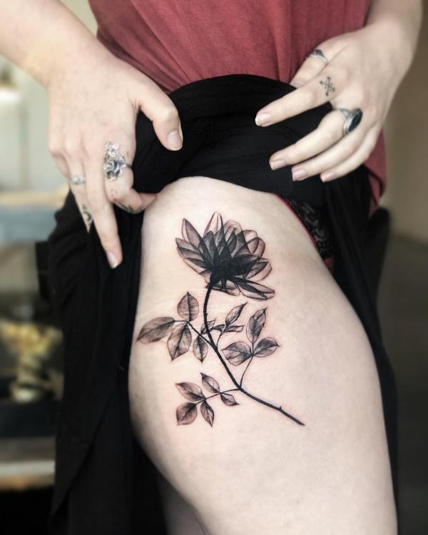black and white rose on thigh