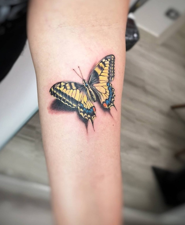 tribal butterfly tattoo hip