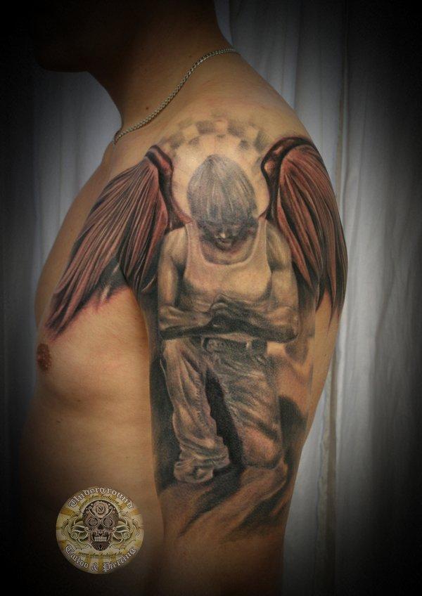 fallen angel wings tattoo chest