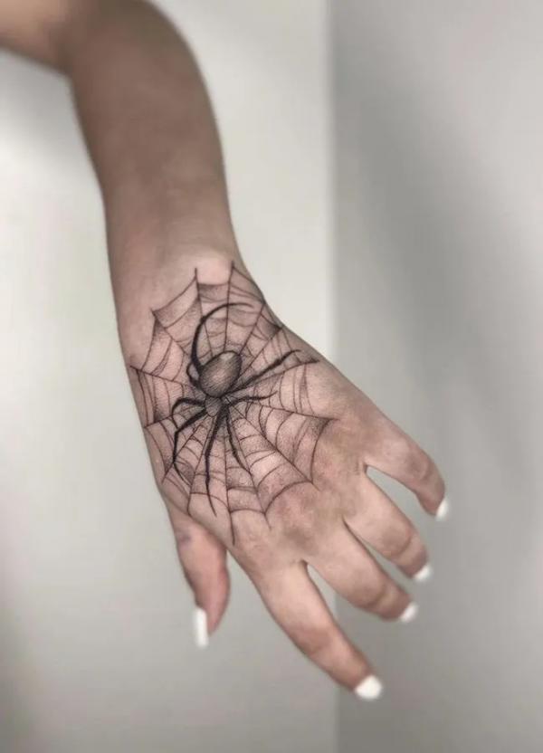 spider web tattoo hand