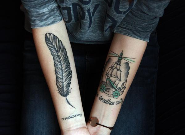 Two feathers on the left inner arm.