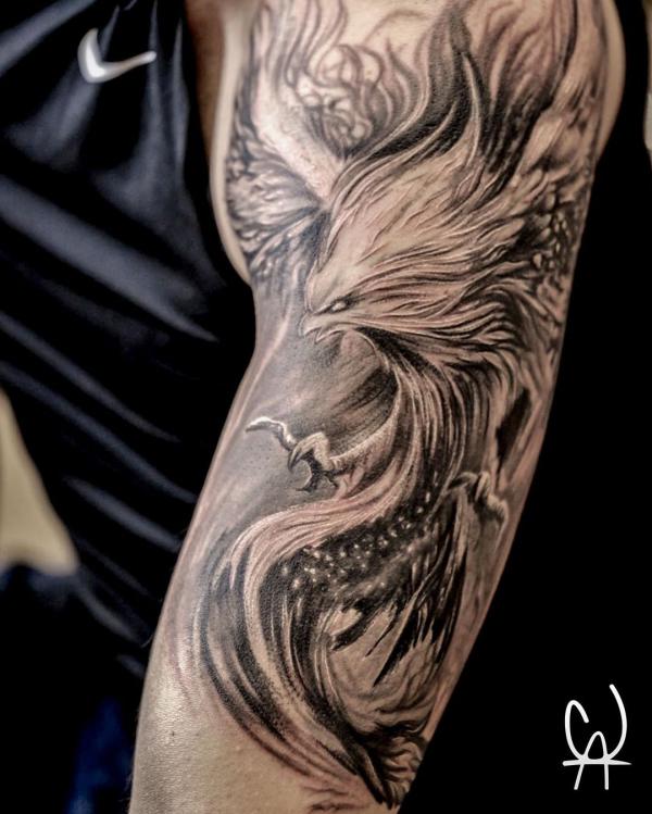 black and grey realistic Phoenix tattoo