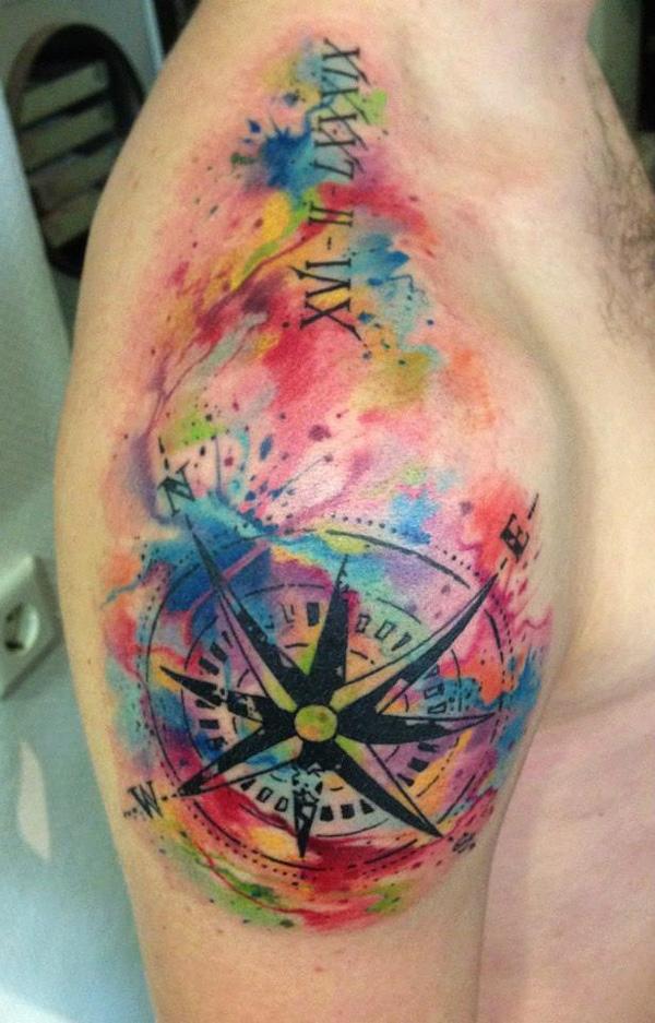 Watercolor wind rose tattoo on shoulder