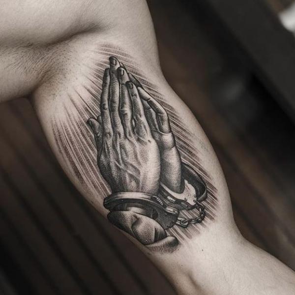 praying hands tattoo with angel wings