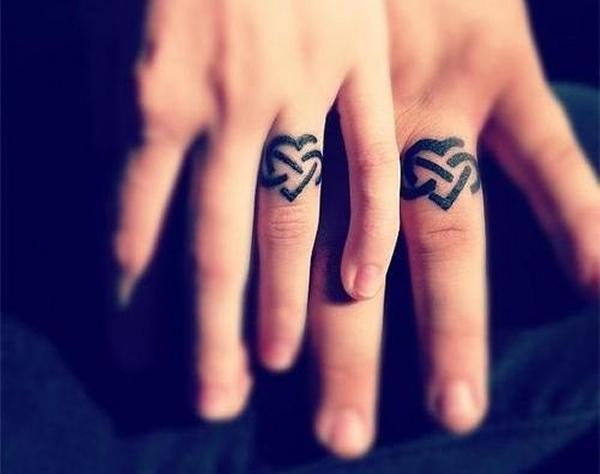 Finger tattoos.