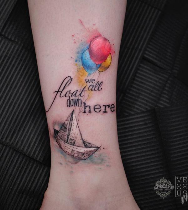 Tiny sailboat tattoo, done in fine line, located on the