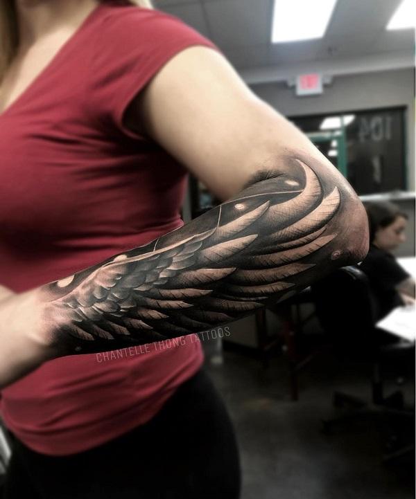 angel wing tattoos on upper arm