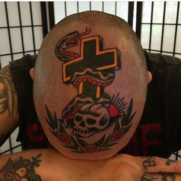 Skull and cross entwined with a snake