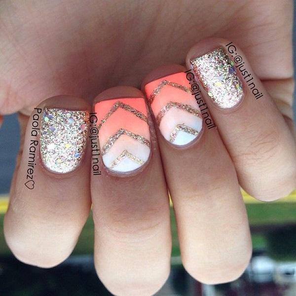 Nothing more can get sparkler than this dazzling ensemble of white and melon polish topped with silver glitter. The glitters have been arranged to form thin v shapes on the gradient to give it a more sophisticated look. A real catchy nail art that’s fun to create and look at.