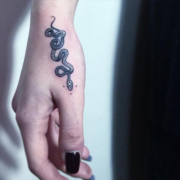 Small Snake tattoo | Small snake tattoo, Snake tattoo, Hand tattoos