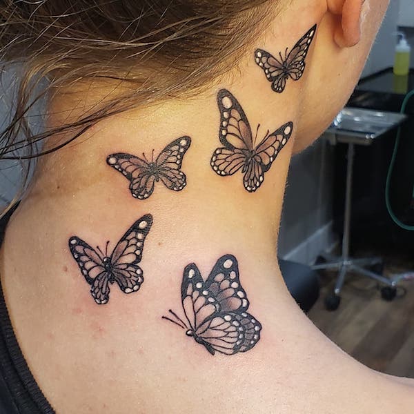 red and blue three Butterflies tattoo on shoulder