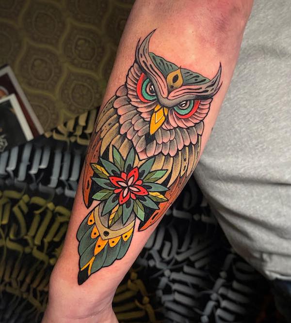 Traditional style owl tattoo on the thigh