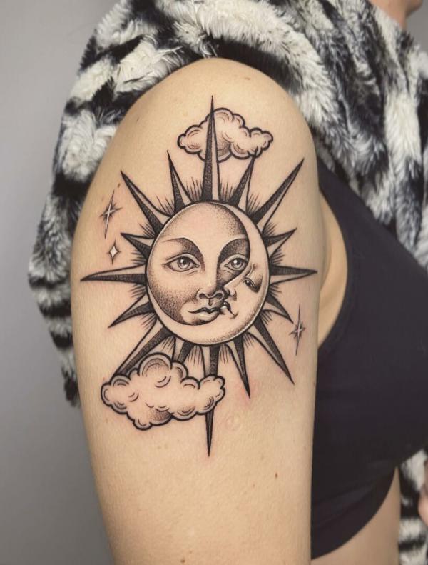 Moon tattoo on the right shoulder.