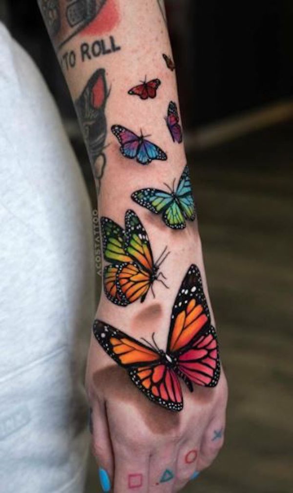 colorful butterfly leg tattoos