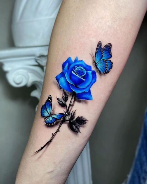 Blue butterfly and rose tattoo