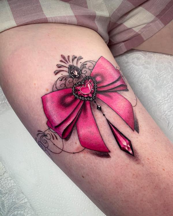 Red and Black Bow Tattoo on Hip