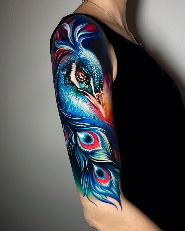 30 Colorful Peacock Tattoos On Leg