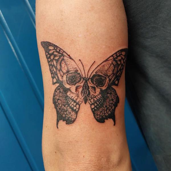 traditional butterfly skull tattoo