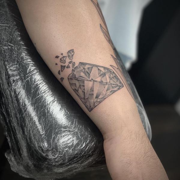 Guys sleeve tattoos w/ lighthouse, diamond, and heart