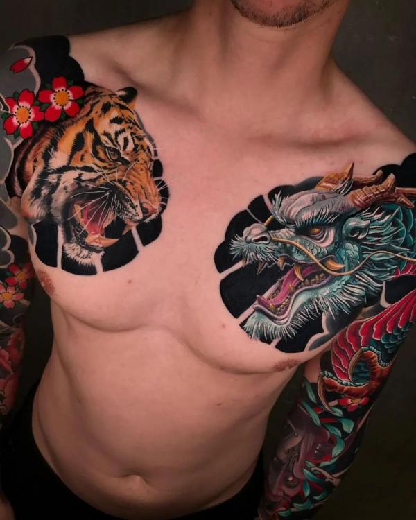 howardnealtattoos:skin-rip-tiger-tattoo-by-a-howard-neal-wwwluckybellacom- tiger-tattoo-tigers-skin-rip-skin-tear-white-tiger-chest-chest-tattoo
