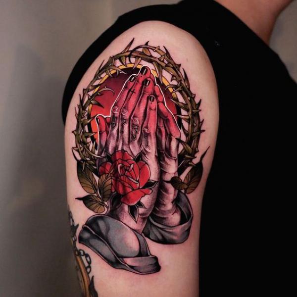 praying hands with rose tattoo