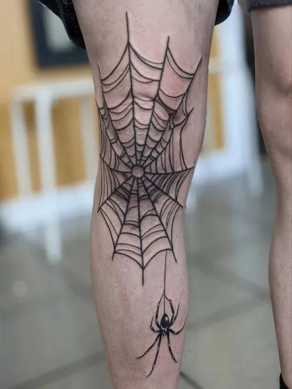 traditional spider web elbow tattoos