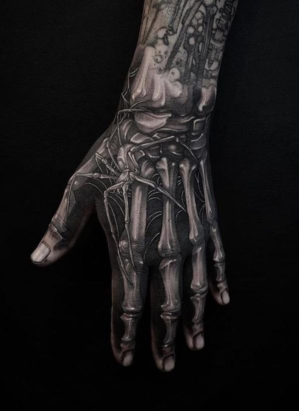 60 Skeleton Hand Tattoo Ideas with Meaning