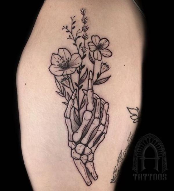 Skeleton hand tattoo with floral ornaments done by kaurdaljeett The  lines and shading are both on point in this black and grey piece   Instagram