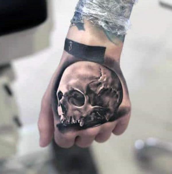 50 Skull Hand Tattoo Designs with Meaning | Art and Design