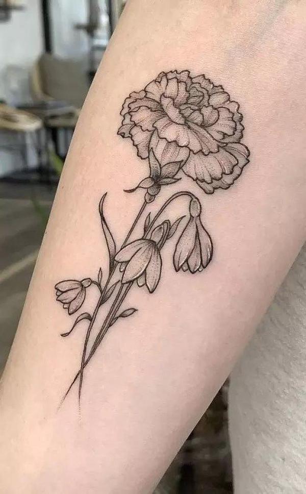 Black and grey carnation and snowdrop tattoo