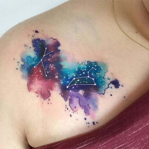 Minimalist galaxy tattoo on the inner forearm.