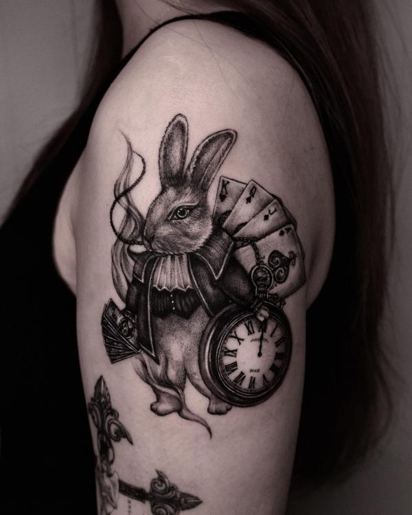 briyuntattoos:fun-illustrative-white-rabbit -from-alice-in-wonderland-alice-in-wonderland-rabbit -illustrative-black-and-grey-line-art-crosshatch