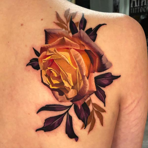 One line rose tattoo on the upper back.