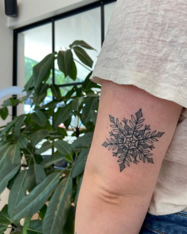 Simple Snowflake Chin Tattoo - Best Tattoo Ideas Gallery