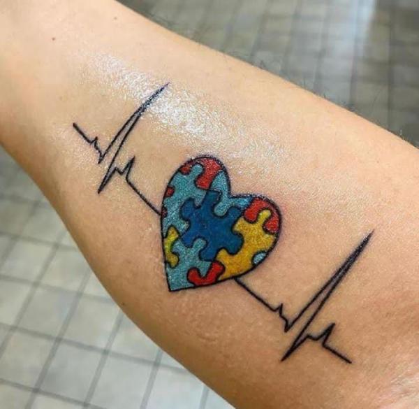 Puzzle heart with heartbeat tattoo