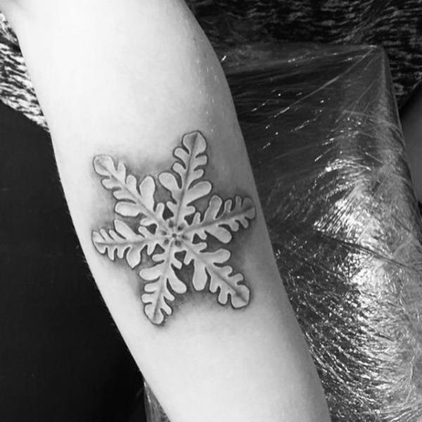 White snowflake on the ankle - Tattoogrid.net