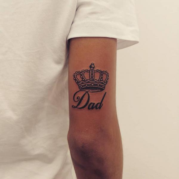 Crown for dad back of arm tattoo