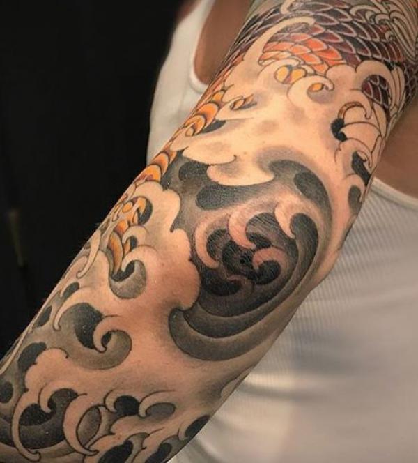 Cool Half Sleeve Wave Tattoo Design