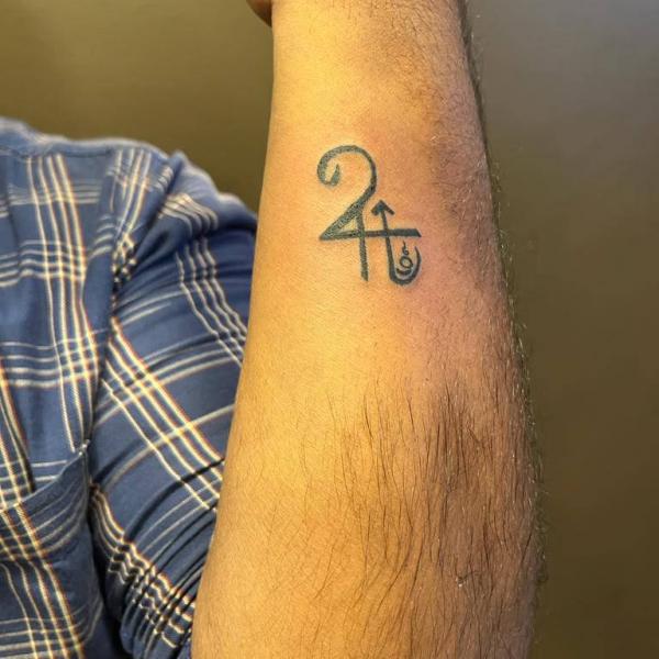 Small Sagittarius and Jupiter glyph tattoo