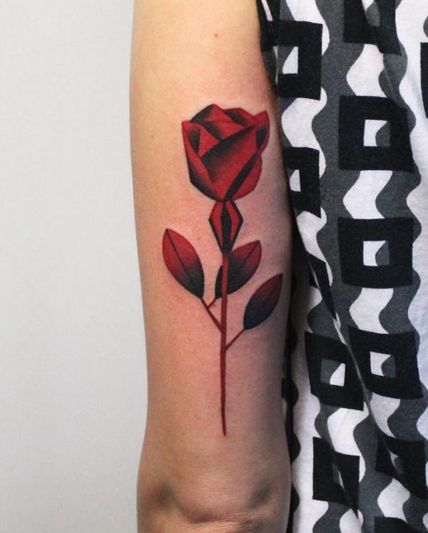 Stylized rose back of arm tattoo