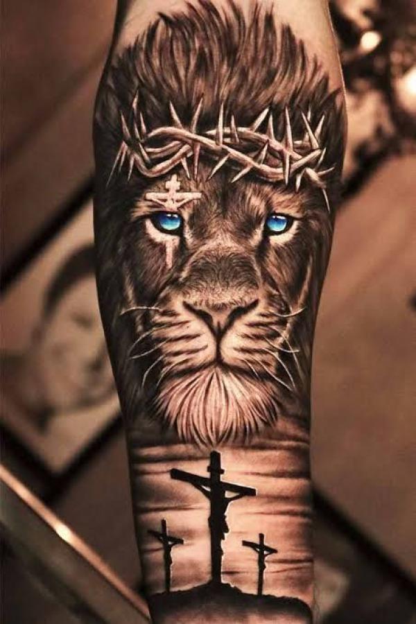 This beautiful tattoo of a lion and lioness incorporates heraldic designs  to add to the symbolism of royalty | Ratta Tattoo