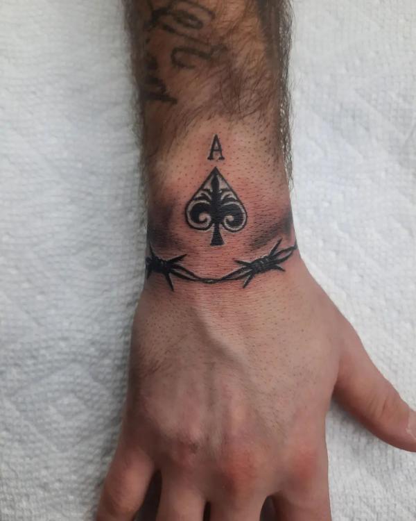 little spade tattoo on wrist - Design of TattoosDesign of Tattoos