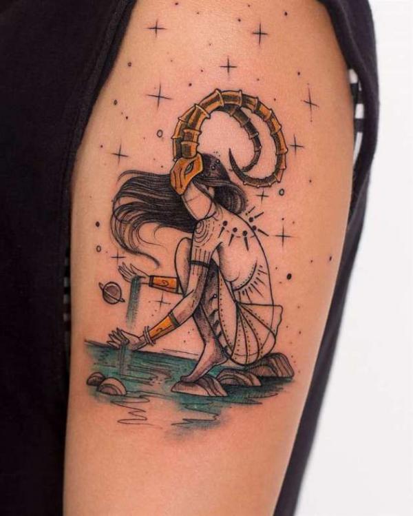 Minimalist capricorn zodiac symbol tattoo behind the