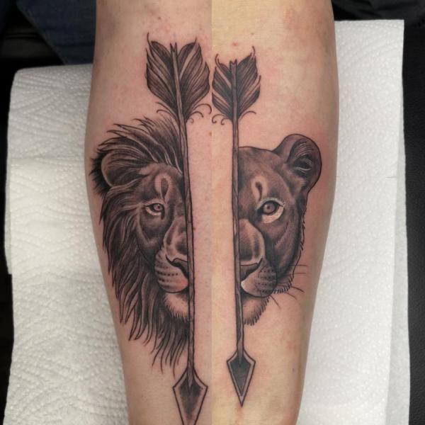 Half Lion king and hald queen with arrows tattoo