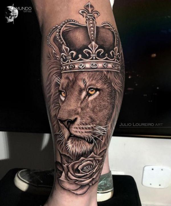 Realistic Lion king with crown and rose tattoo